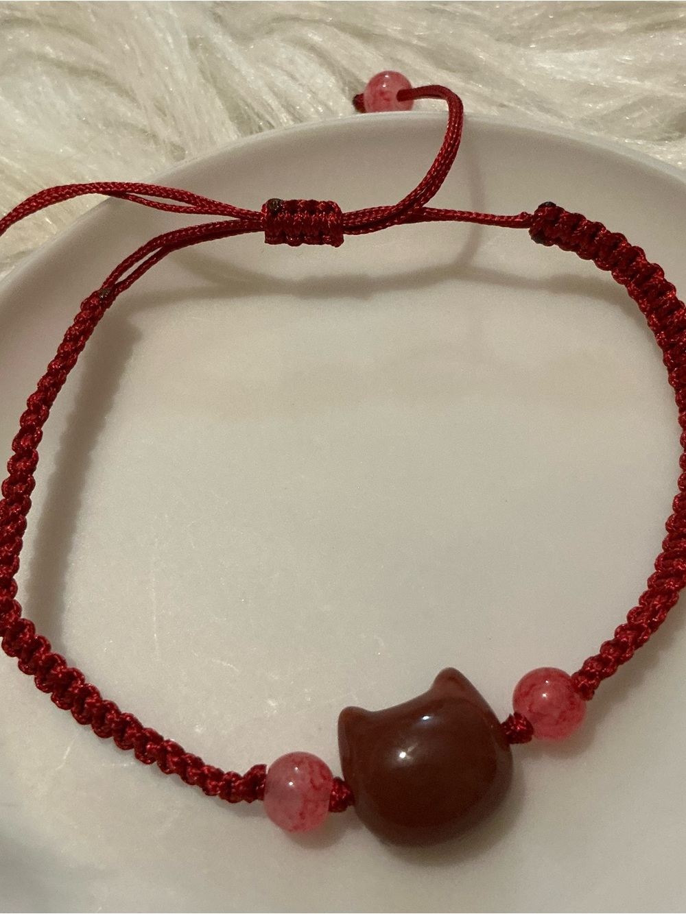 Red/pink ish cat/kitty string bracelet